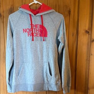 The North Face women’s gray hoodie with red accents